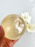 Load image into Gallery viewer, Big Rainbows! Honey Calcite Sphere| Optical Honey Calcite | Reiki | Home Decor | Gifts
